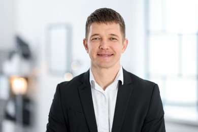Photo of Portrait of handsome middle aged man indoors