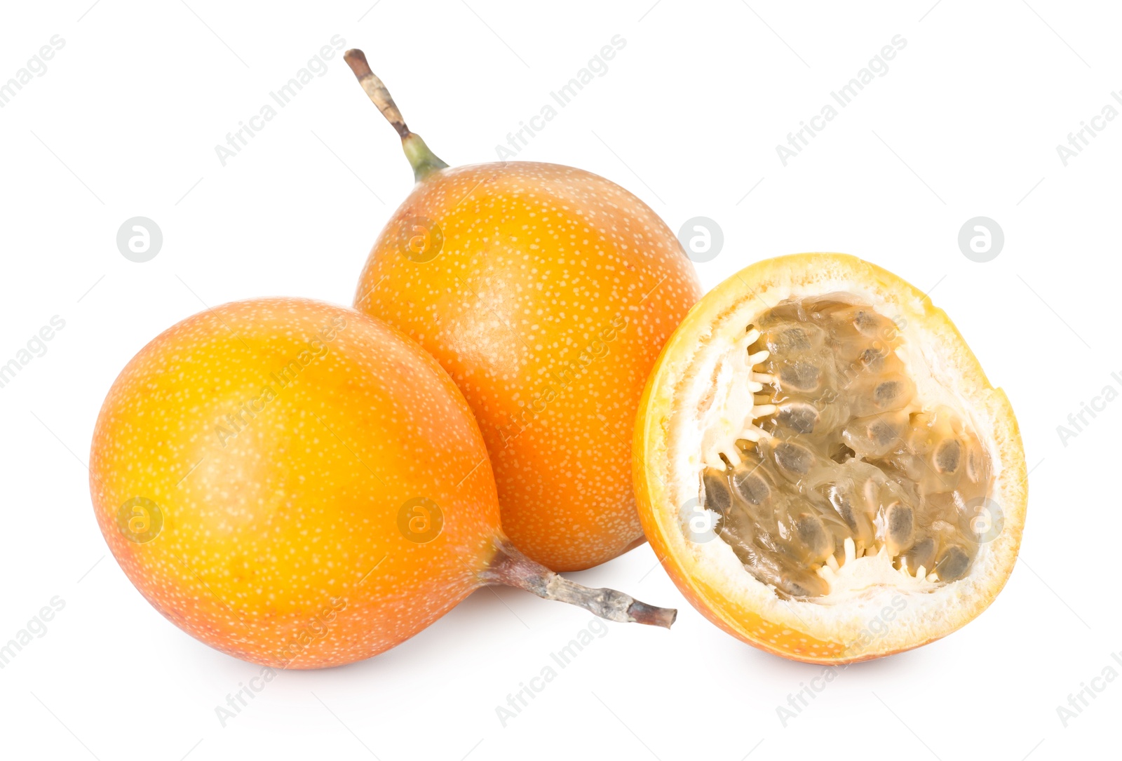 Ripe yellow passion fruits isolated on white Photo of Ripe yellow passion fruits isolated on white