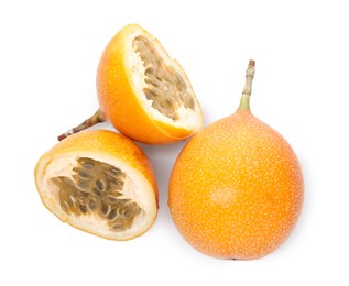 Photo of Ripe yellow passion fruits isolated on white, top view