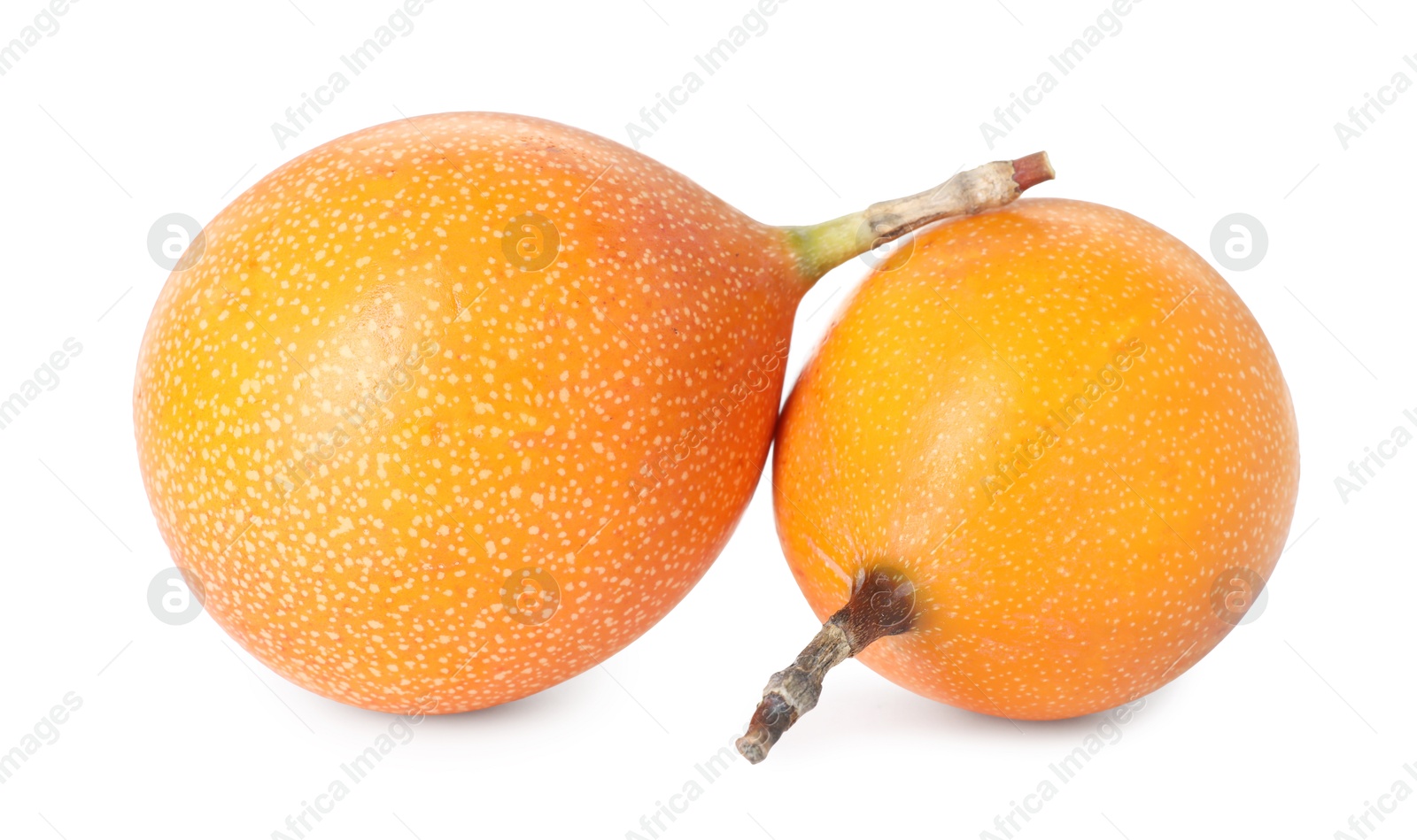 Whole ripe yellow passion fruits isolated on white Photo of Whole ripe yellow passion fruits isolated on white