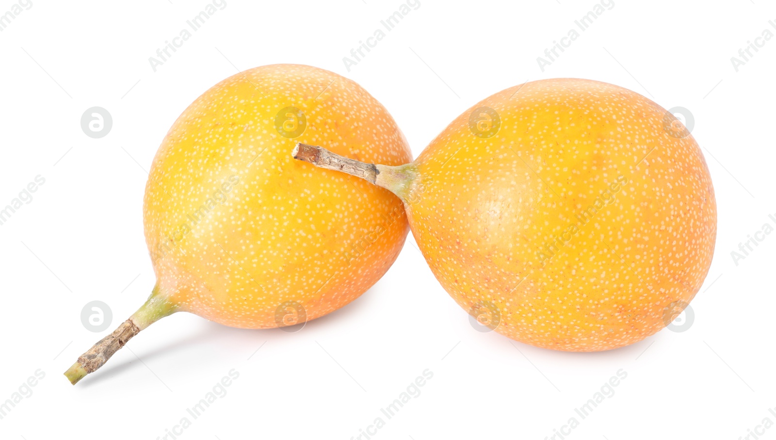 Whole ripe yellow passion fruits isolated on white Photo of Whole ripe yellow passion fruits isolated on white
