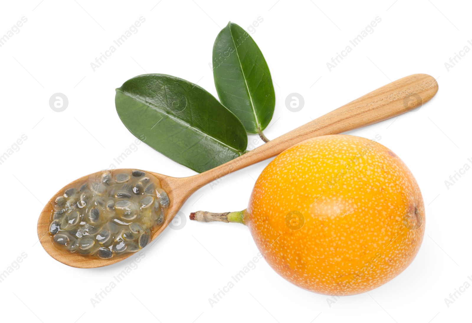 Ripe passion fruit, seeds, green leaves and spoon isolated on white, top view Photo of Ripe passion fruit, seeds, green leaves and spoon isolated on white, top view