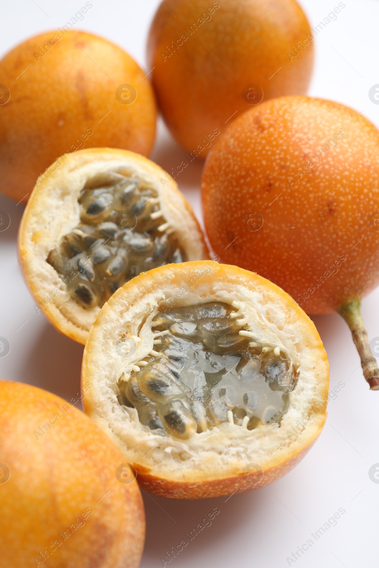 Ripe passion fruits on white background, closeup Photo of Ripe passion fruits on white background, closeup