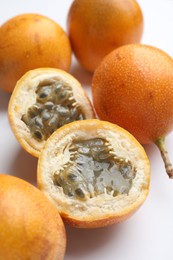 Photo of Ripe passion fruits on white background, closeup