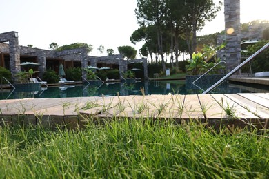Photo of Outdoor swimming pool at resort on sunny day