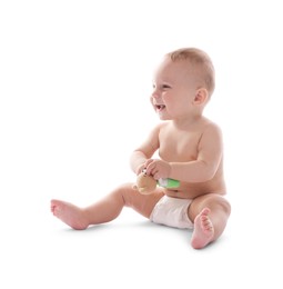 Photo of Cute little baby with toy on white background
