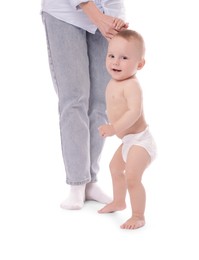 Photo of Cute little baby standing on white background