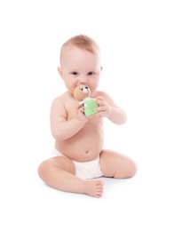 Photo of Cute little baby with toy on white background