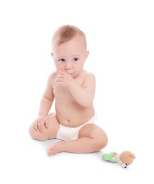 Photo of Cute little baby with toy on white background