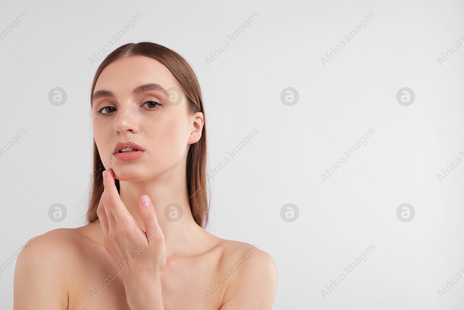 Portrait of attractive young woman on white background. Space for text Photo of Portrait of attractive young woman on white background. Space for text