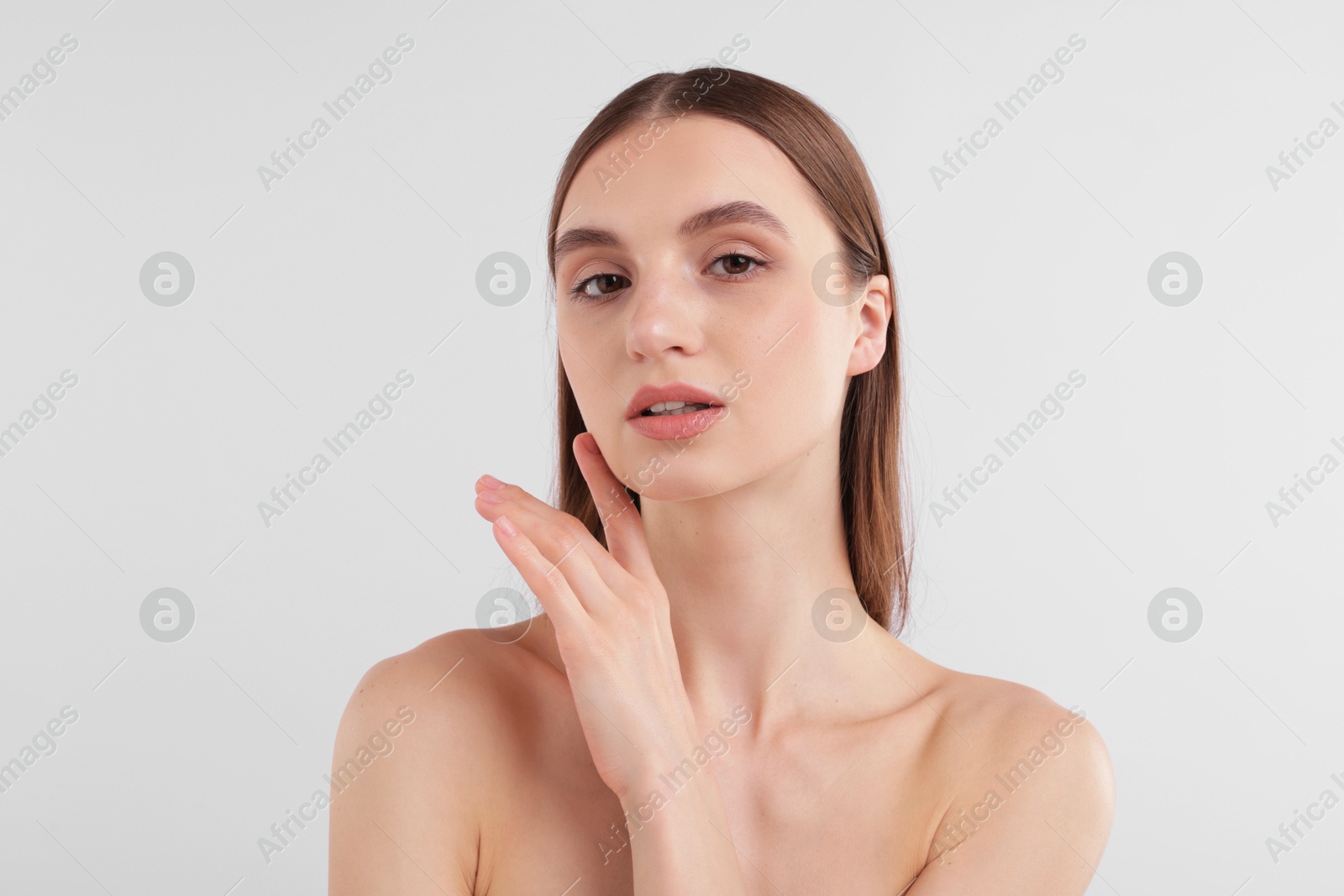 Portrait of attractive young woman on white background Photo of Portrait of attractive young woman on white background