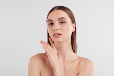 Photo of Portrait of attractive young woman on white background