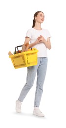 Photo of Woman with shopping basket full of products on white background