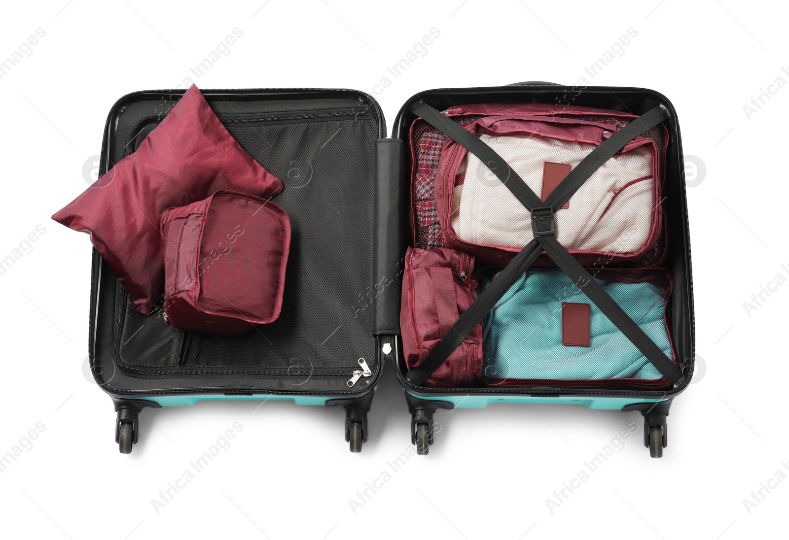 Open suitcase with packing cubes isolated on white, above view Photo of Open suitcase with packing cubes isolated on white, above view
