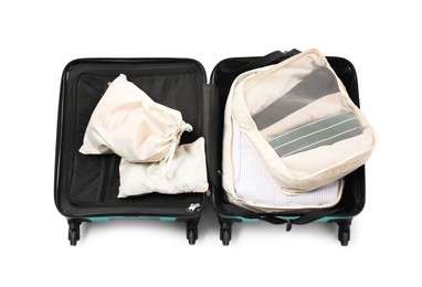 Photo of Open suitcase with packing cubes isolated on white, top view