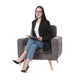 Photo of Professional psychologist with clipboard and pen in armchair on white background
