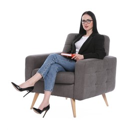Photo of Professional psychologist with notebook in armchair on white background
