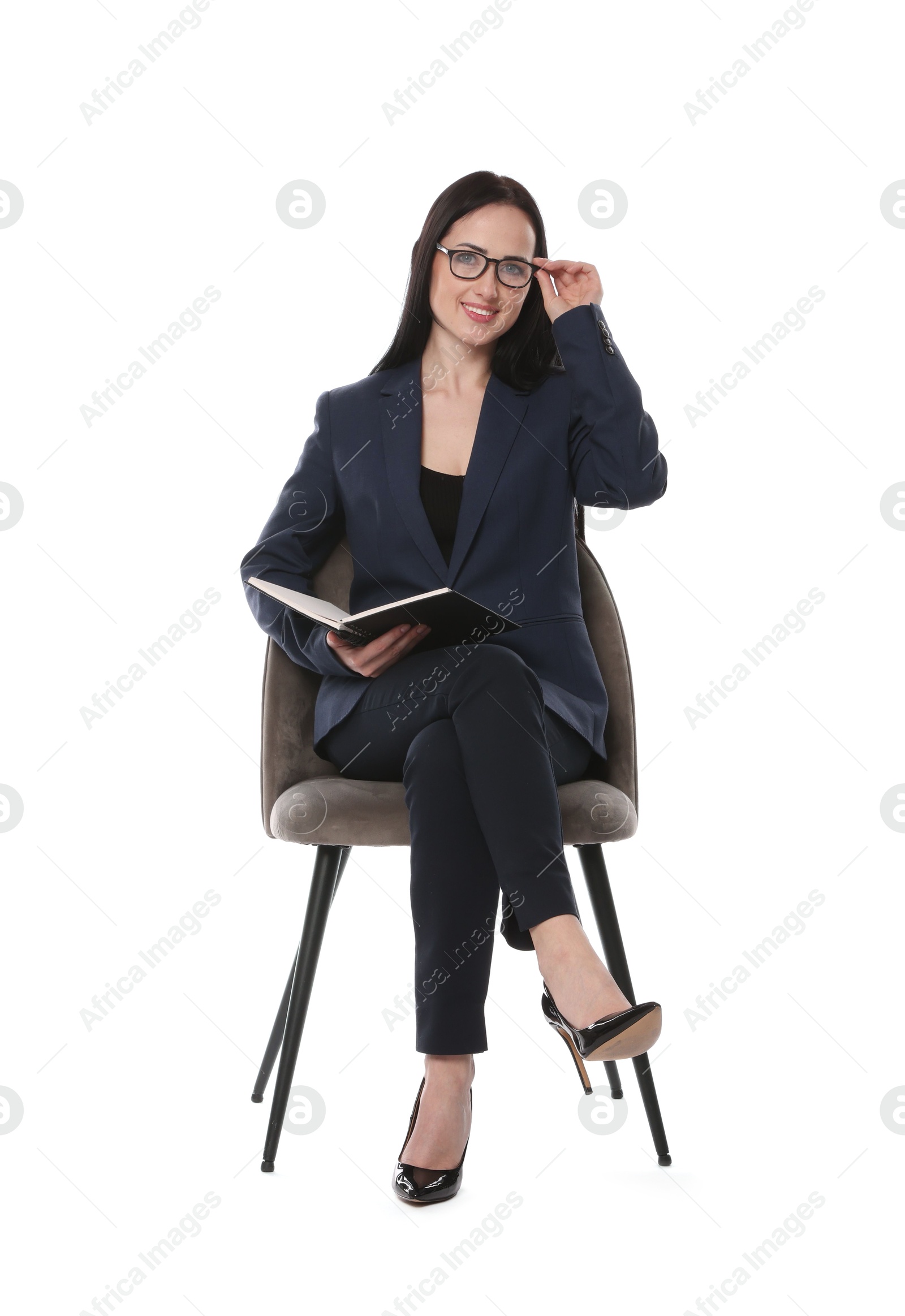 Professional psychologist with notebook in office chair on white background Photo of Professional psychologist with notebook in office chair on white background