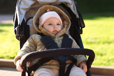 Photo of Cute little baby in stroller at park