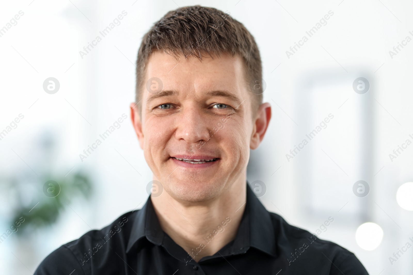 Portrait of handsome middle aged man indoors Photo of Portrait of handsome middle aged man indoors