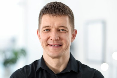 Photo of Portrait of handsome middle aged man indoors