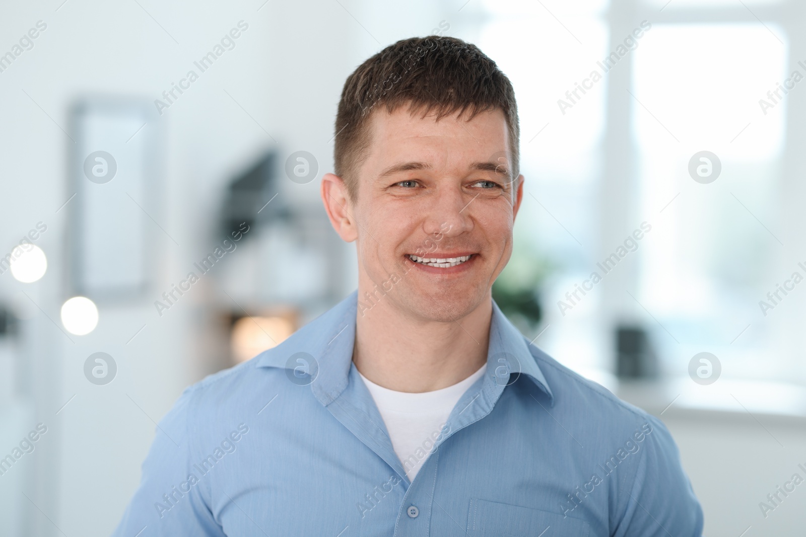 Photo of Portrait of handsome middle aged man indoors