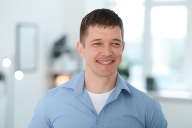 Photo of Portrait of handsome middle aged man indoors