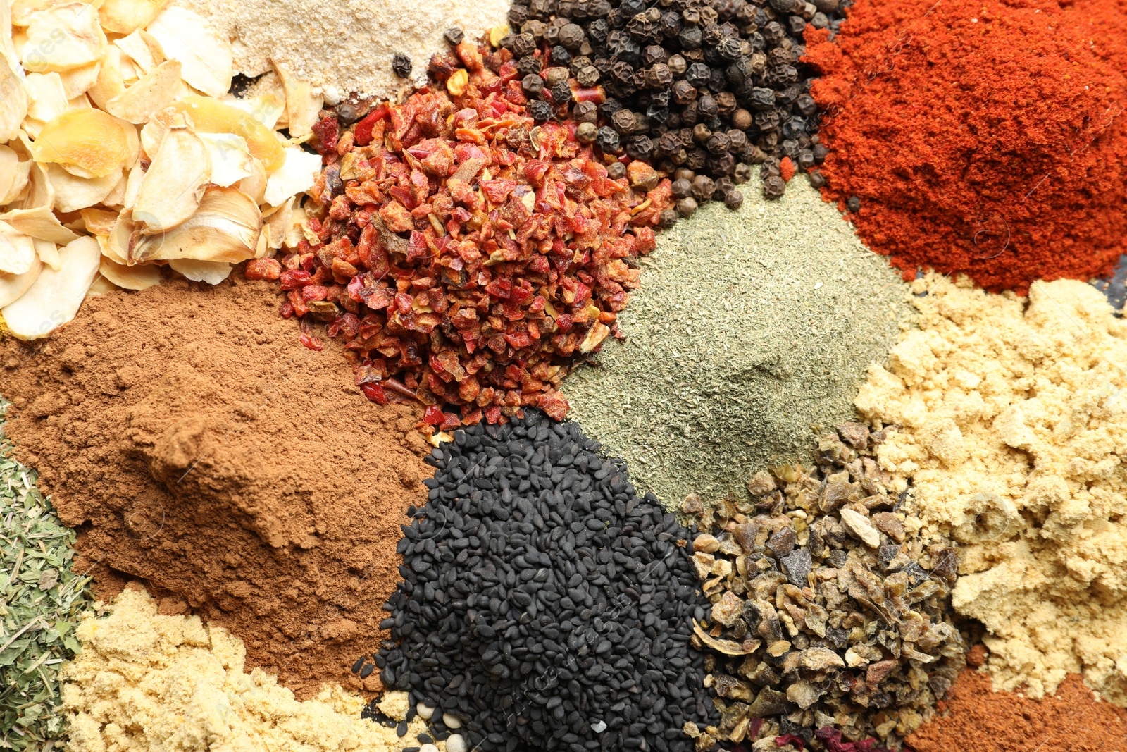 Many different spices as background, top view Photo of Many different spices as background, top view