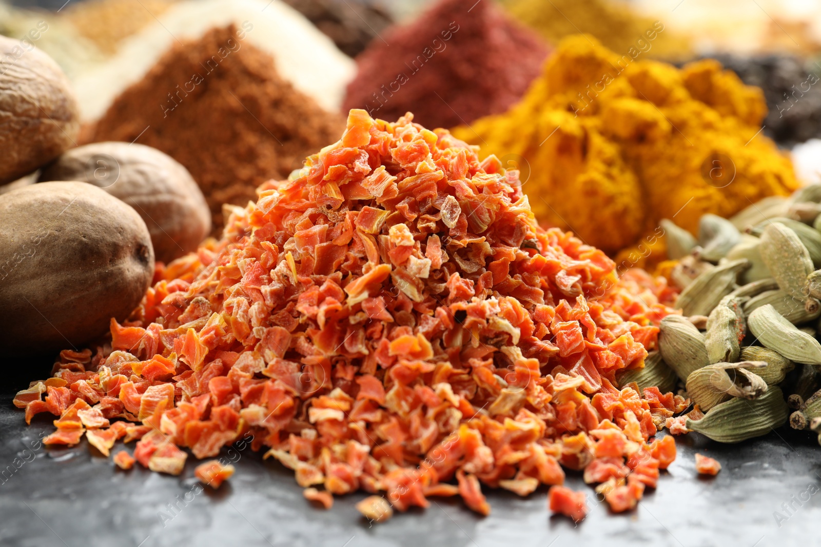 Many different spices on dark table, closeup Photo of Many different spices on dark table, closeup