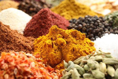 Photo of Many different spices as background, closeup view