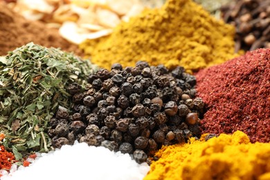 Photo of Many different spices as background, closeup view