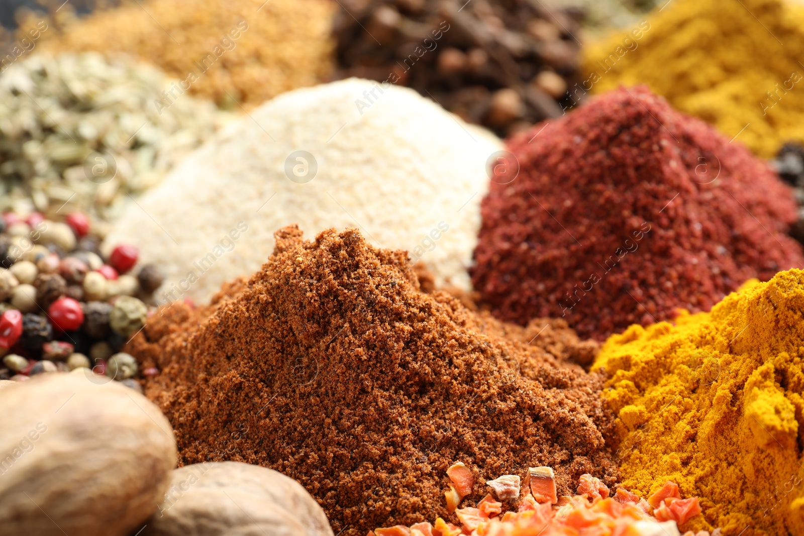 Many different spices as background, closeup view Photo of Many different spices as background, closeup view