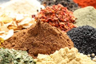 Photo of Many different spices as background, closeup view