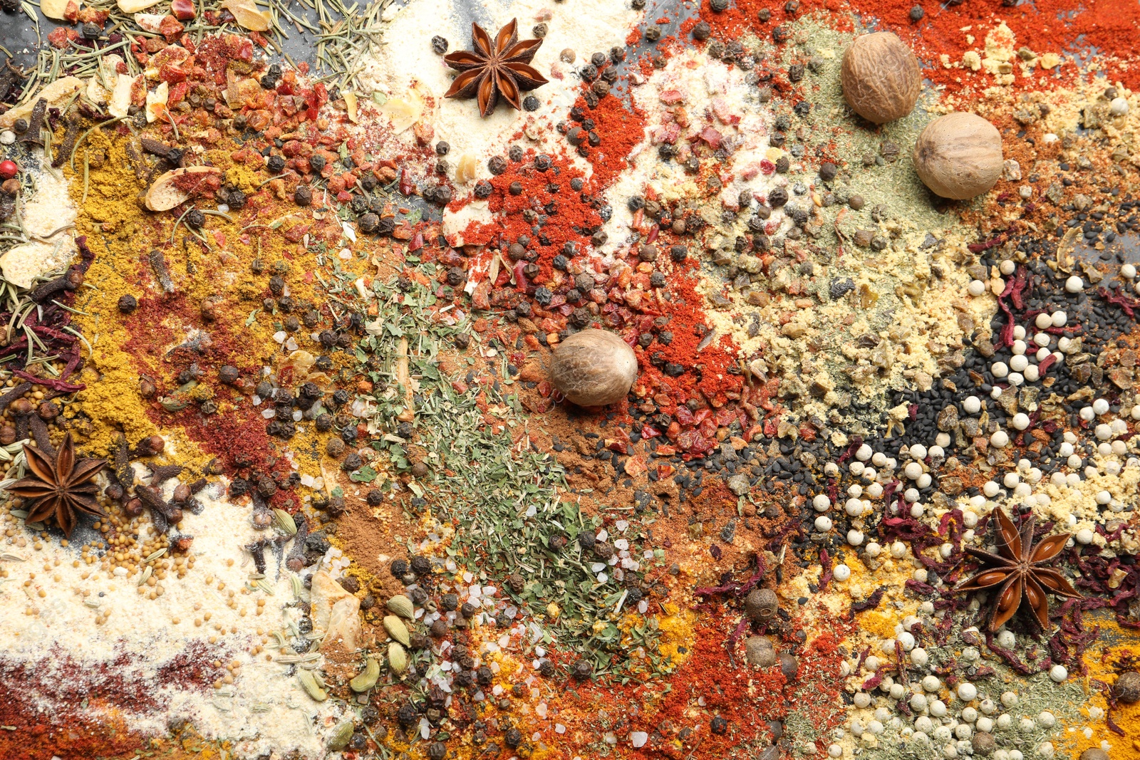 Many different spices as background, top view Photo of Many different spices as background, top view
