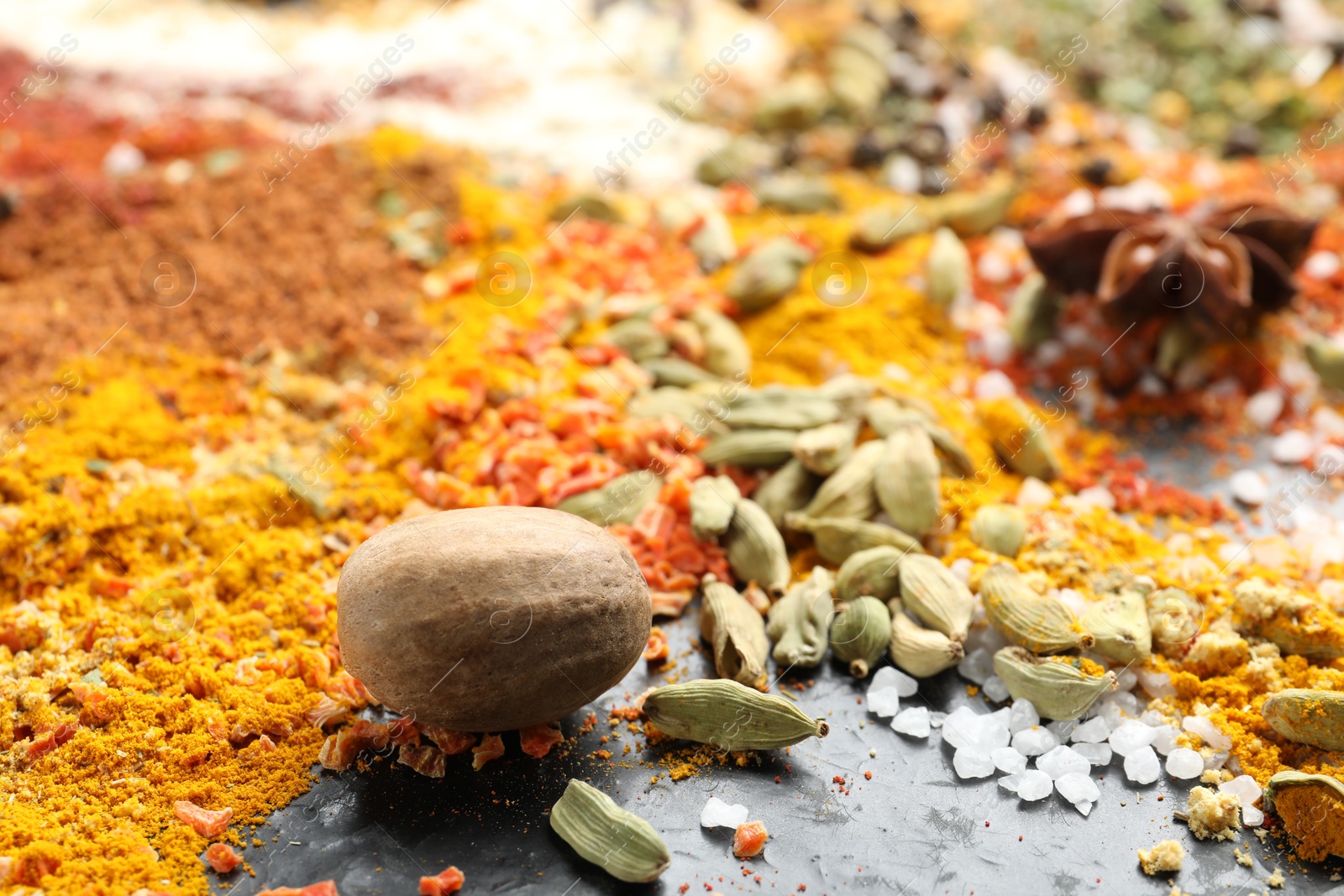 Many different spices on dark table, closeup Photo of Many different spices on dark table, closeup