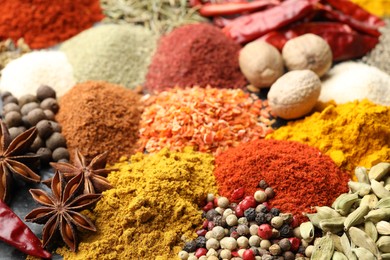 Photo of Many different spices on table, closeup view