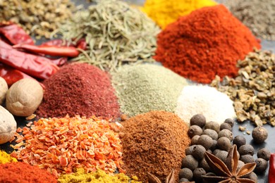 Photo of Many different spices on table, closeup view