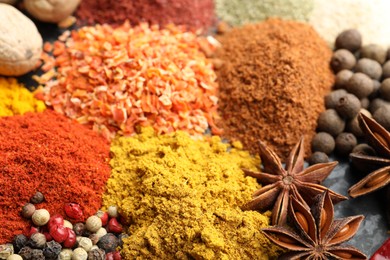 Photo of Many different spices on table, closeup view