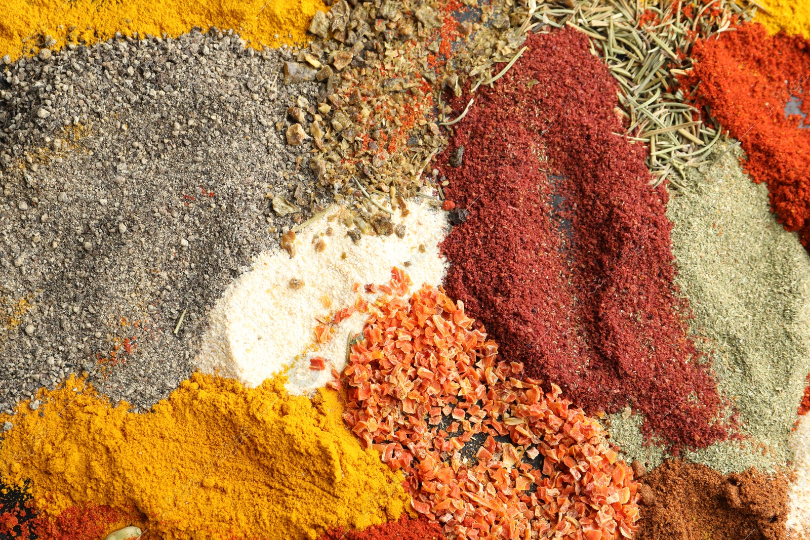 Many different spices as background, top view Photo of Many different spices as background, top view