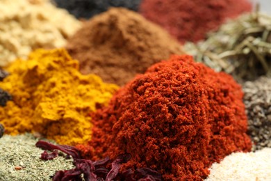 Photo of Many different spices as background, closeup view
