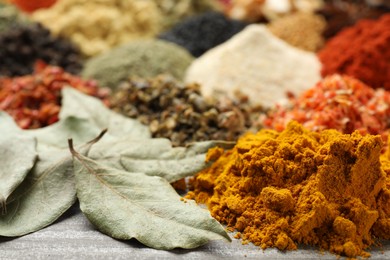 Photo of Many different spices on table, closeup view
