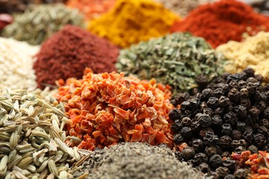 Photo of Many different spices as background, closeup view