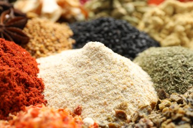 Photo of Many different spices as background, closeup view