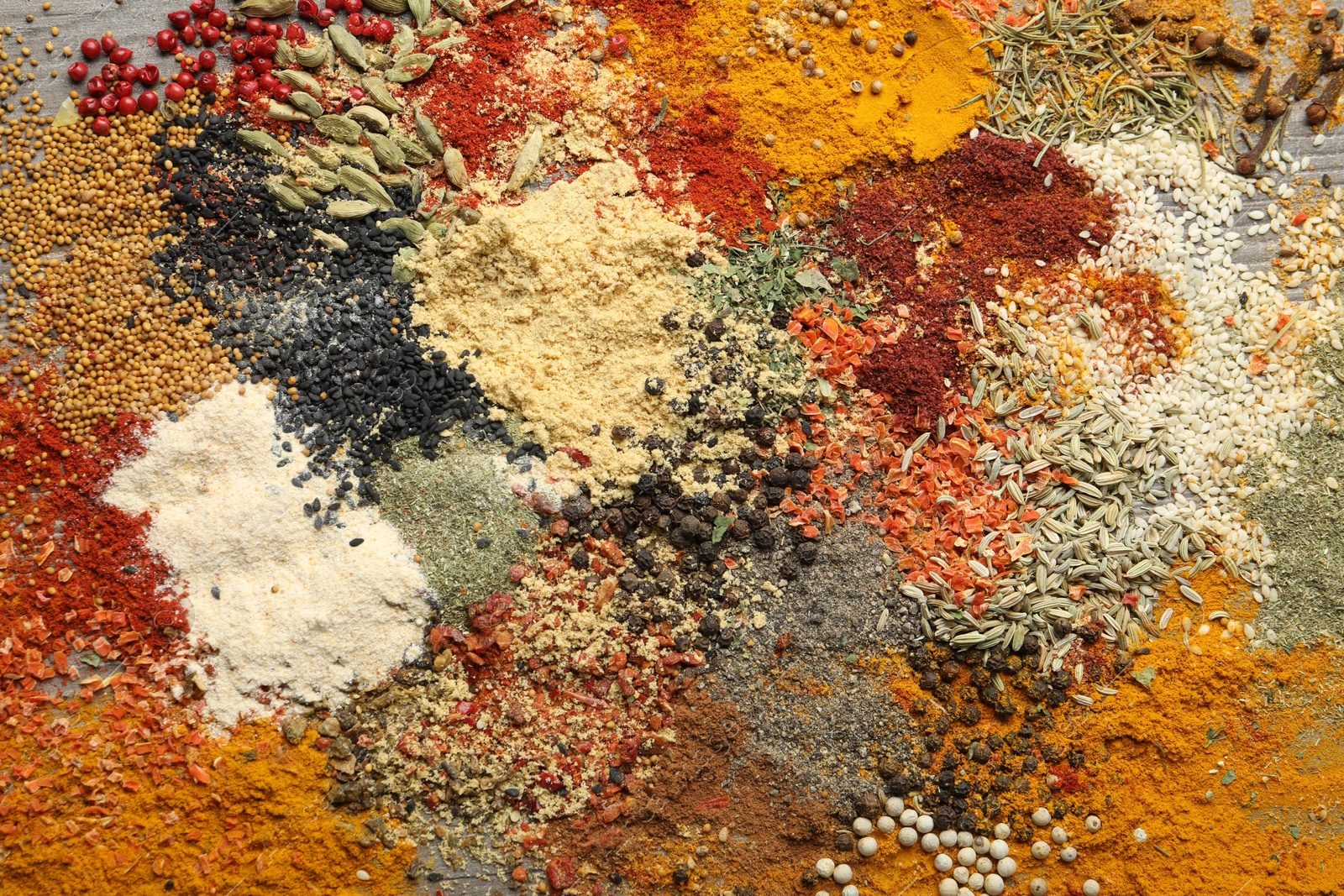 Many different spices as background, top view Photo of Many different spices as background, top view