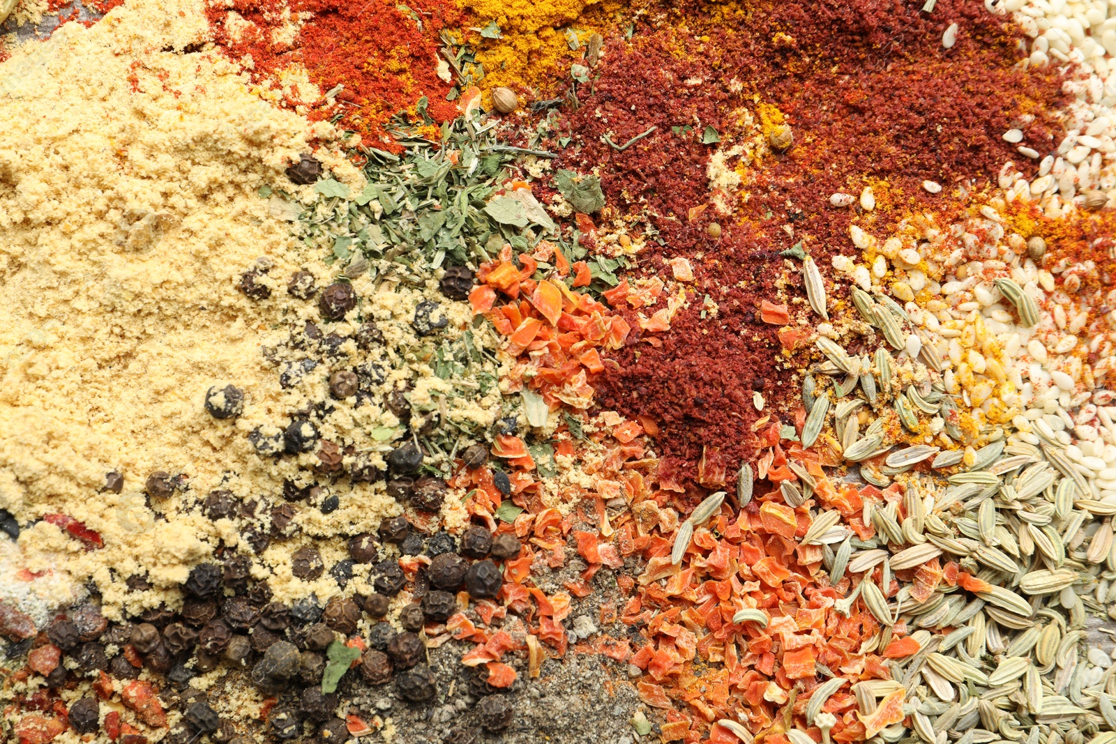 Many different spices as background, top view Photo of Many different spices as background, top view