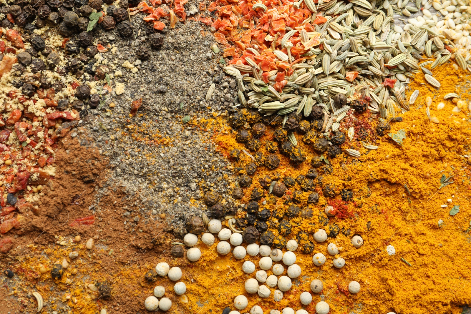 Many different spices as background, top view Photo of Many different spices as background, top view
