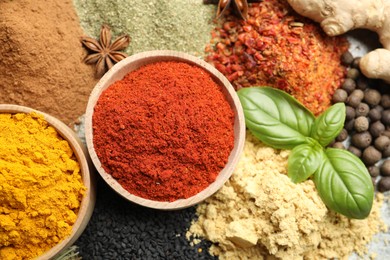 Photo of Many different spices as background, top view