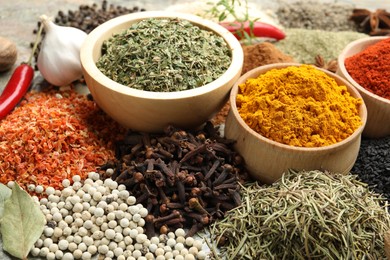 Photo of Many different spices on table, closeup view