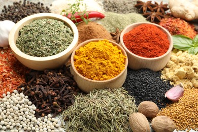 Photo of Many different spices on table, above view