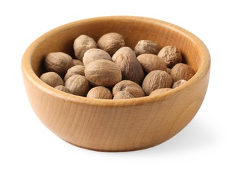 Photo of Fresh nutmegs in bowl isolated on white